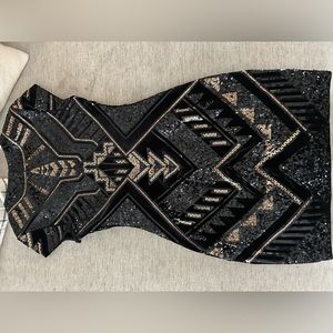 The great gatsby themed dress size small black and gold with lots of sequins